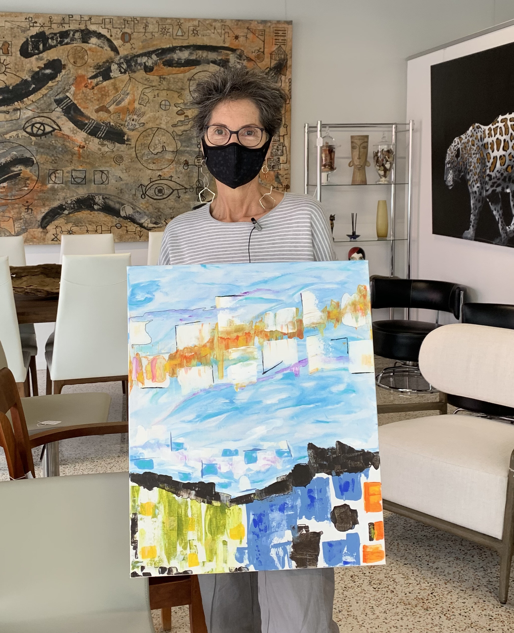 Artist Grace Howl shows the painting she completed during her project “Dragon” with poet Cedric Hameed.